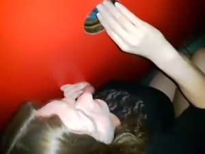Happy wife takes a load through the glory hole