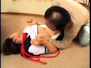 Helpless Asian teen has an older man shoving his cock down 