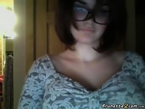 This brunette with glasses shows her big boobs and sucks a