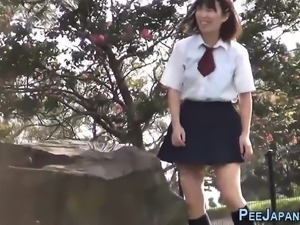 Teen asians pee outdoors