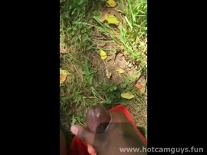 Black guy jerks off and cums outdoor laying on a blanket in the grass
