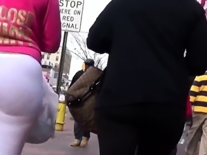 Street voyeur follows a hot ebony babe with a lovely booty