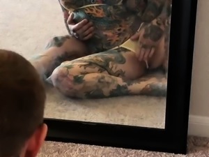 Tattooed couple having wild sex in front of the mirror