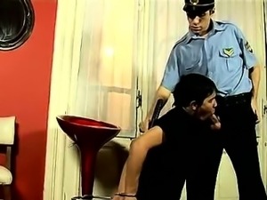 Young hunk sucking on a police officer\'s cock