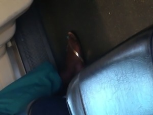 Indian woman barefoot shoe change on train