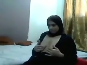 Middle East amateur brunette nympho in traditional gown shows off her tits