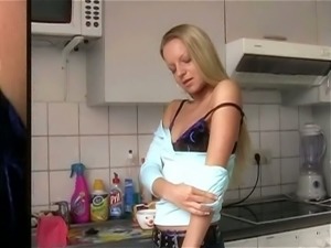 Stunning amateur blondie in the kitchen strips on cam