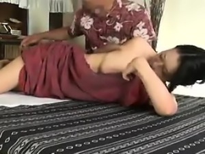 Busty Asian babe gets a nice massage and then some boob gro
