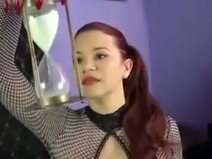 Redhead sexpot posing on cam in sexy fishnet bodystocking