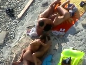 Spying on two friends fucking their bitches on the beach