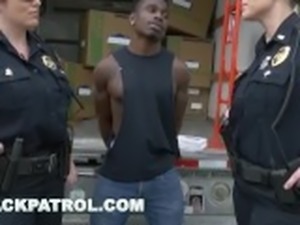 BLACK PATROL - Thug Gets Busted By MILF Cops and Punished with Sex