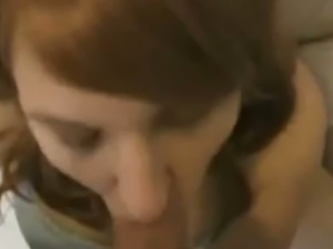 Beautiful face of red haired girl covered with massive cumshot