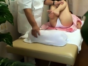 Pretty Japanese girl with sexy legs enjoys a nice massage