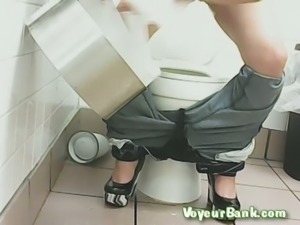White brunette lady in the public restroom pisses without sitting on the shitter