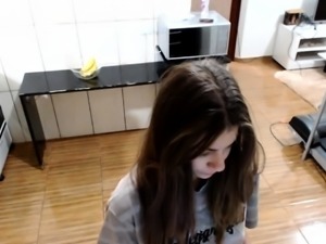 Slim brunette teen plays with her fiery twat on hidden cam