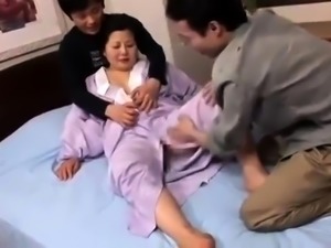 Voluptuous Japanese housewife gets banged rough by two boys