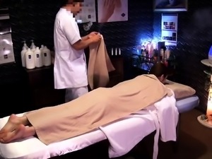 Sultry Asian girl enjoys strong orgasms on the massage table
