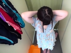 Voyeur spying on a pretty Japanese teen in the dressing room