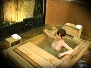 Dazzling Oriental girl being put to sleep in the bathhouse 
