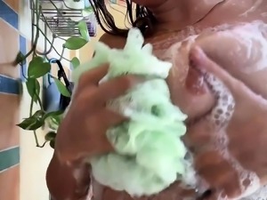 Sexy brunette exposes her wonderful big tits in the shower
