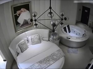 Spy cam in motel room captures Asian couple having sex