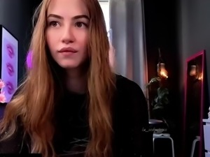 Busty redhead babe strips and masturbates