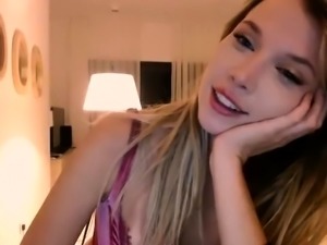 Two blonde babes in a lesbian action involving a dildo